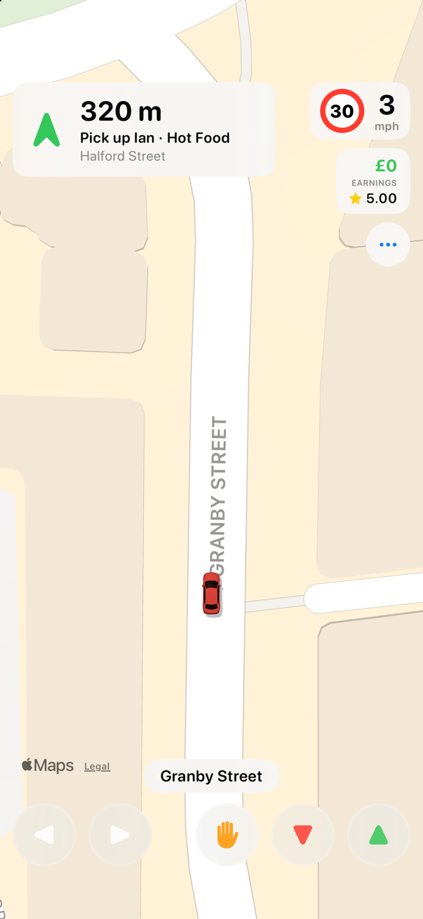 Top-down gameplay: the taxi on a real city street, heading for a rider waiting at a green pickup marker